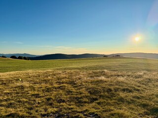 Golden hour light over the high open pastures of the Schnepfenried © Mickaël LEBRET