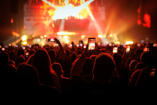 People Holding Smartphones to Record Live Music Concert Event