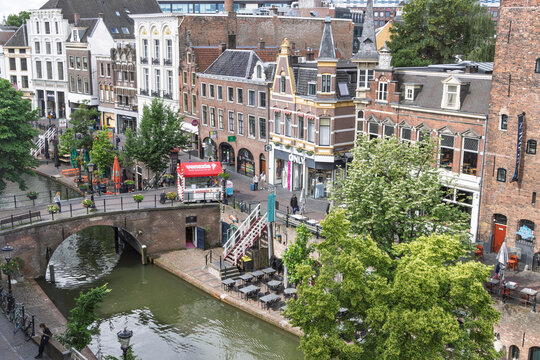 Utrecht, Netherlands, 11 June 2026. Elevated view looking down at the famous Oudegracht canal, showing historic bridges, waterside caf&eacute; terraces, and traditional buildings.