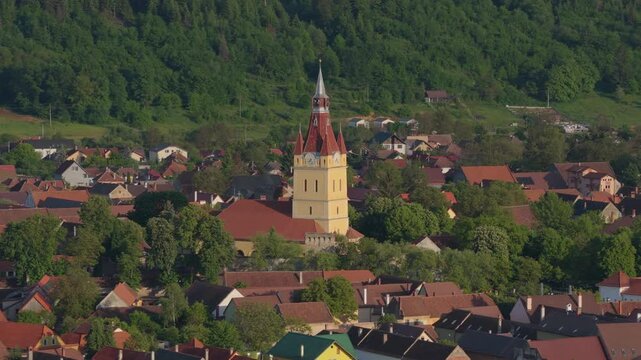 Aerial super telephoto orbit of Cristian fortified church parallax effect