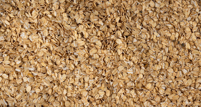 Oat flakes textured pattern, rolled oatmeal macro background