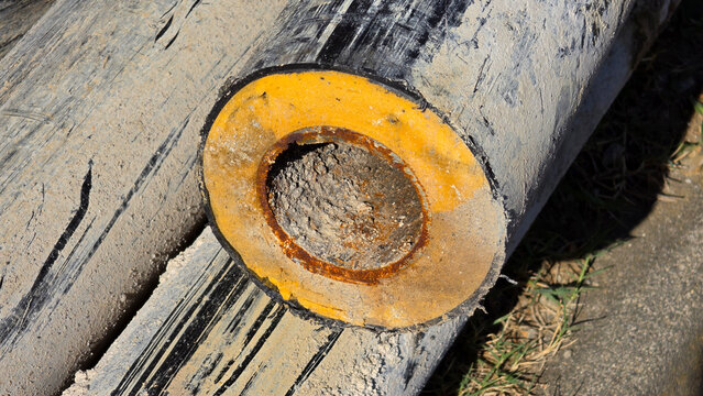 Cross section of old preinsulated district heating pipe with clogged interior