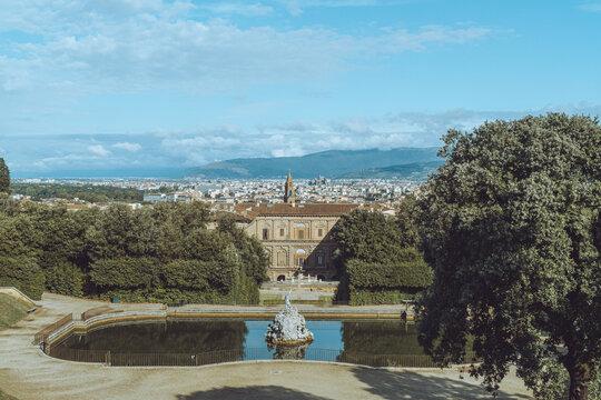 oboli Gardens, Florence, Italy, panoramic view of the Neptune fountain pond with Pitti Palace and the cityscape in the background.
