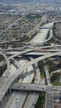 AERIAL: Spectacular Judge Pregerson Interchange showing multiple Roads, Bridges, Highway with little car traffic in Los Angeles, California on Beautiful Sunny Day 