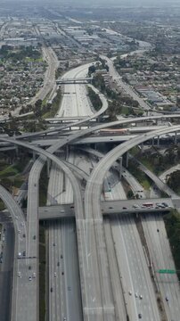 AERIAL: Spectacular Judge Pregerson Interchange showing multiple Roads, Bridges, Highway with little car traffic in Los Angeles, California on Beautiful Sunny Day 