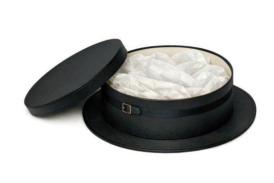 A black hat box with white tissue inside, ready for use