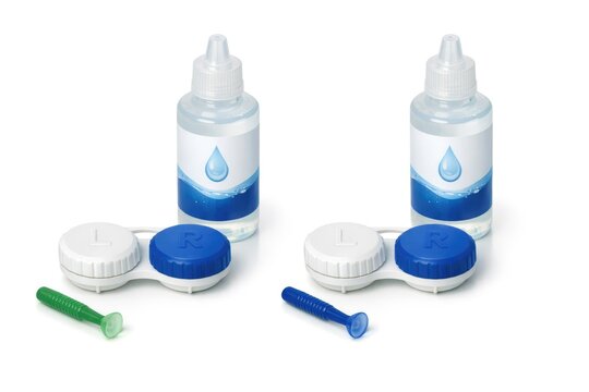 A pair of bathroom essentials, toothbrush and toothpaste, sit side by side on a counter
