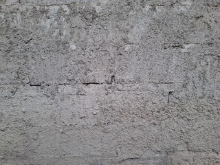 Rough cement plaster wall surface texture background. © DeDagang