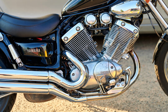 Minsk, Belarus. May 21, 2026. Yamaha Virago cruiser motorcycle V-twin engine with shiny chrome exhaust pipes closeup.Yamaha motorcycle engine with reflective chrome surfaces and mechanical details