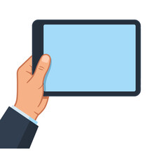 A hand holds a tablet with a bright blue touchscreen © cemif