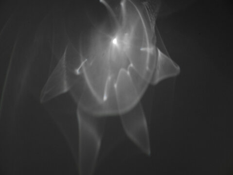 Radiant glass caustics and shadows. Abstract caustic light patterns created by refraction and reflection on a transparent surface. Can be used as overlay elements for design projects. 