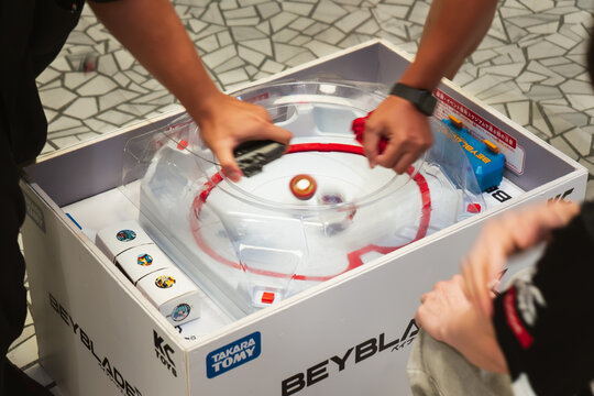 Bangkok, Thailand - September 13, 2025 : People playing Beyblade X, a battling spinning top, in a weekly competition event at a shopping mall.
