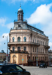 Fototapeta premium Building with a distinctive tower in Chernivtsi, Ukraine, seen on a clear day with blue skies and light clouds