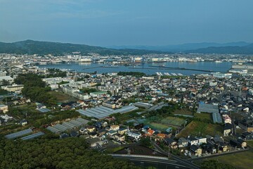 Fototapeta premium Aerial drone photo of Miho no Matsubara coastline and port town, Shizuoka, Japan