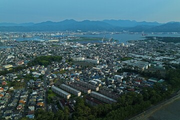 Fototapeta premium Aerial drone photo of residential area and industrial port in Shimizu, Shizuoka, Japan