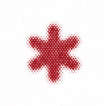 Red halftone asterisk star symbol on textured white paper