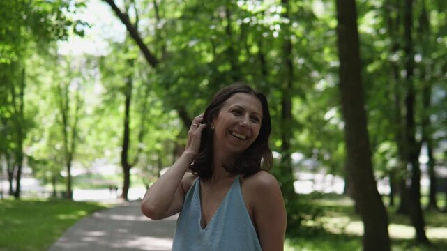 Chronological portrait sequence showing woman walking along paved park path from early greeting (2%) through mid interaction (25&ndash;75%) to final farewell (98%)