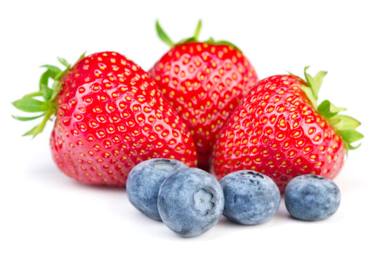 Strawberry and blueberry on white backgrounds.
