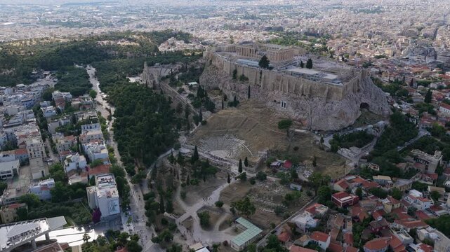 Athens aerial orbiting cityscape with Parthenon temple and Acropolis citadel, iconic ancient greek monuments and landmarks above Dionysiou Areopagitou street