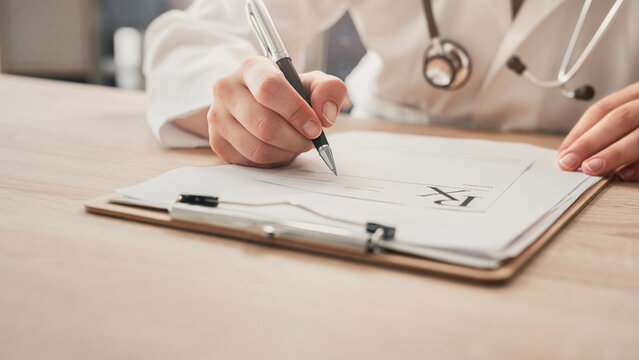 Medical doctor completing administrative healthcare records