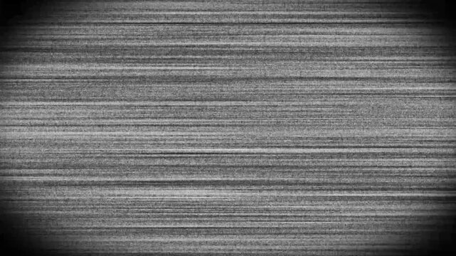 Gray textured surface reveals gradual abrasion over time in horizontal footage