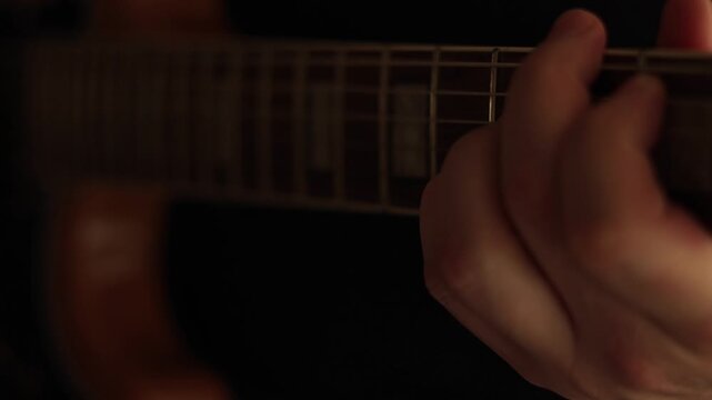 Electric guitar solo - close-up of guitarist fretboard hand