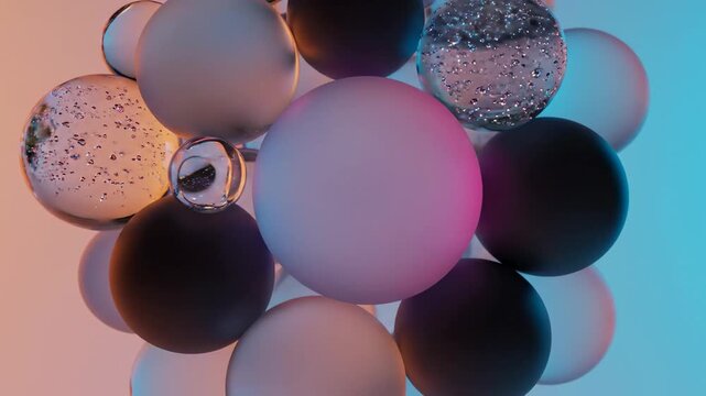 Colorful spheres float in air with bubbles and light reflections in a studio setting