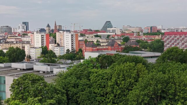City Skyline Green Urban Park Architecture Real Estate Neuroarchitecture Aerial Panorama. A scenic drone perspective shows a dense forest of green park trees. Poznan