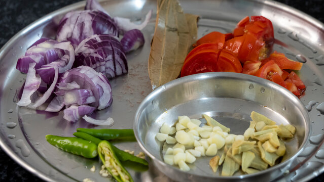 Tomato Ginger Oinion Green Chili Garlic and Ginger cuts for cooking