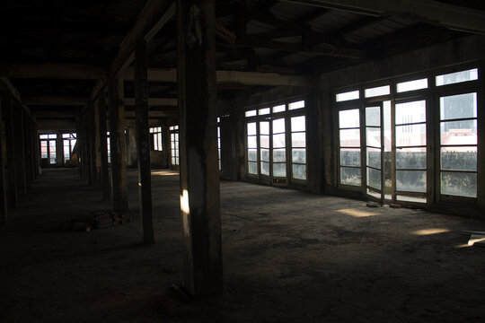 Empty abandoned building interior with natural light