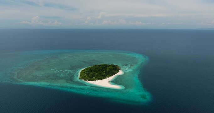 Turquoise water around in Mantigue Island. Camiguin, Philippines.