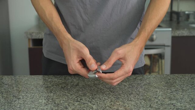Close up man adjusting adjustable wrench with clear sound. Hands turning jaw mechanism of spanner tool. Repair work, mechanical process, maintenance and ASMR concept.