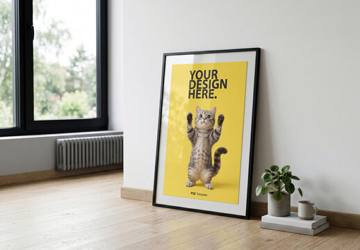 Vertical Poster Mockup in black frame standing on the floor