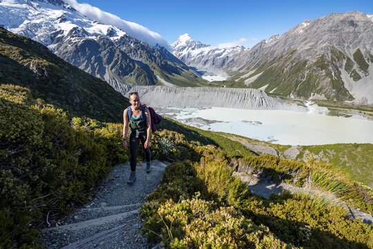 Hiker on a trail, view of Hooker Valley with Mueller Lake, Hooker Lake and Mount Cook, Sealy Tarns Track, Hooker Valley, Mount Cook National Park, Southern Alps, Canterbury, South Island, New Zealand