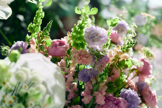 Close up of pastel flower arrangement featuring peonies roses and lisianthus, conveying wedding decor and luxury gifting. Supporting florist branding event marketing and seasonal campaigns