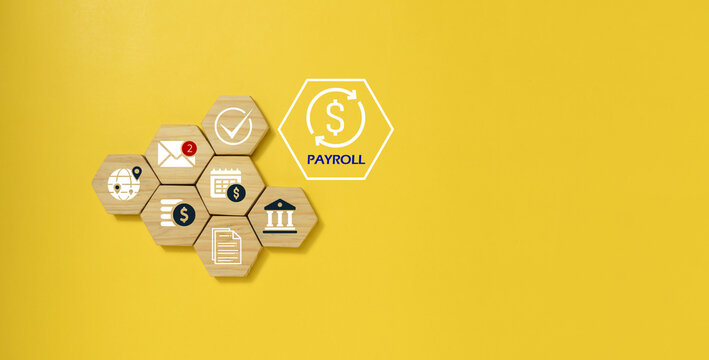 Payroll Management and Salary Processing System Concept with Financial Documents and Compliance concept with wooden cube.