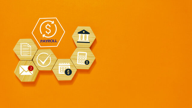 Payroll Management and Salary Processing System Concept with Financial Documents and Compliance concept with wooden cube.