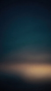Dark moody abstract background with a soft golden glowing light and copy space.