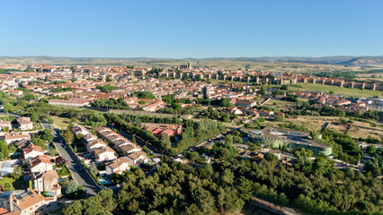 Obraz premium Aerial view of Avila residential quarter with dense green tree canopy streets and houses Spain
