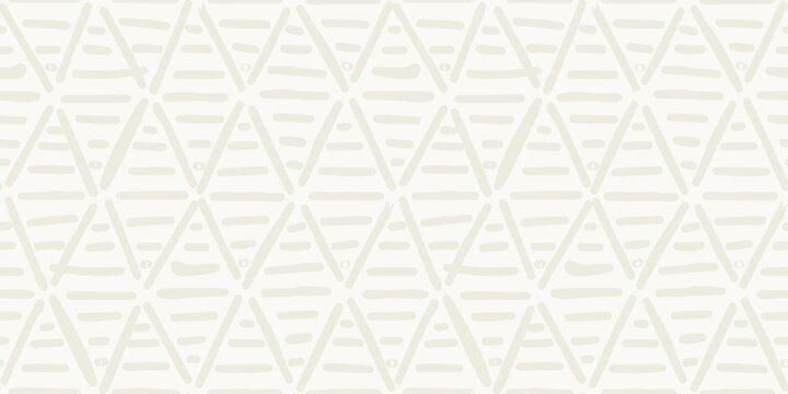 Seamless minimalist geometric pattern with hand drawn beige textured triangles
