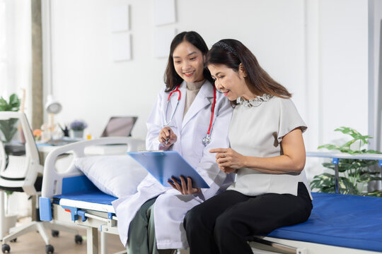 Doctor consulting patient, explaining medical report, healthcare concept.