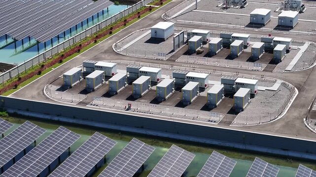 Photovoltaic power station with energy storage battery arrays surrounded by water pools and landscaping