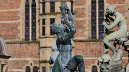 Bronze triton sculpture on neptune fountain at frederiksborg castle © Emil