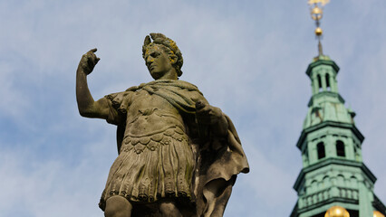 Fototapeta premium Roman style statue with Frederiksborg castle tower