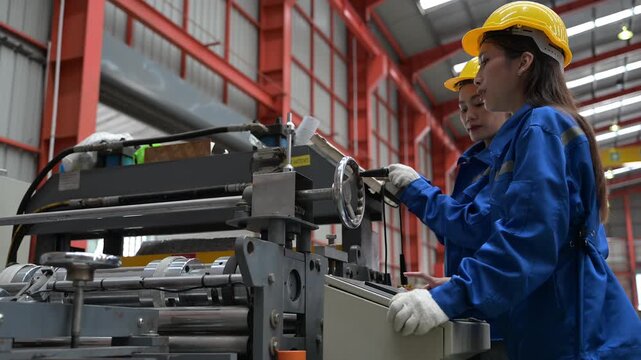Industrial operator adjusting manufacturing machine