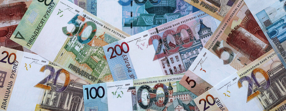 Belarusian ruble money banknotes pile on table. Belarus bills of BYN currency close up