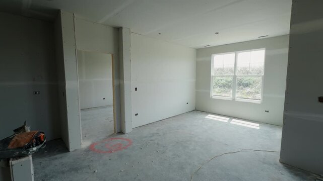 Element of Unfinished interior room in a new residential house with drywall installation. Wide shoot footage