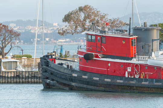Red Tugboat Docked at Harbor
