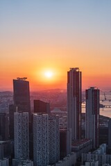 Fototapeta premium Golden sunset over the financial district of Yeouido with modern corporate skyscrapers in Seoul, South Korea