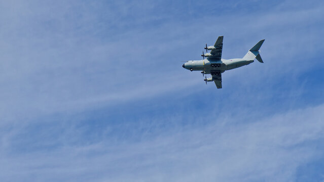 Airbus a400m atlas military transport aircraft flying in blue sky